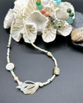 Necklace on coral